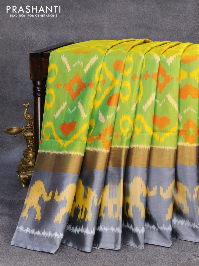 Ikat soft silk saree light green and grey with allover ikat weaves and zari woven simple border