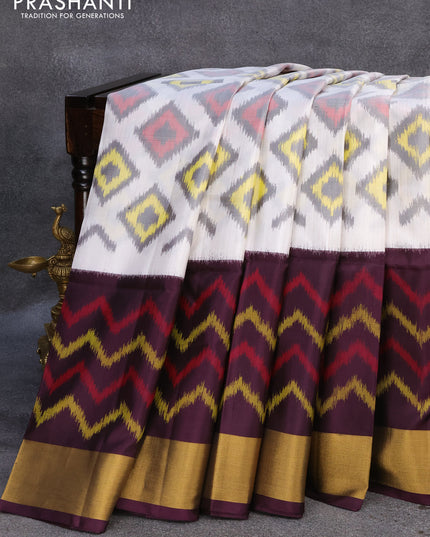 Ikat soft silk saree off white and deep jamun shade with ikat woven geometric butta weaves and zari woven border