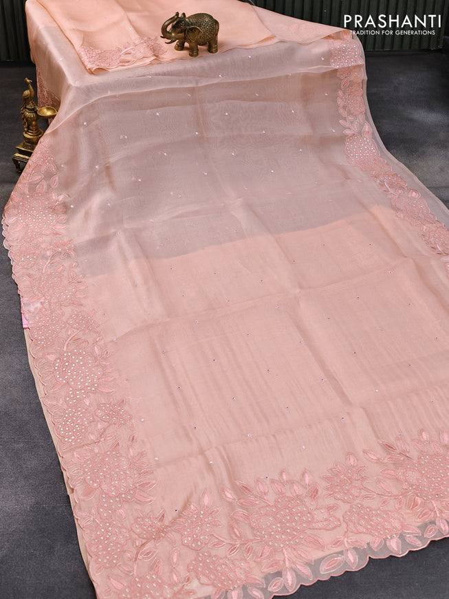 Pure organza silk saree pastel peach with allover mirror work and floral design embroidery work border
