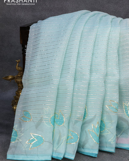 Pure organza silk saree light blue with allover silver zari stripes pattern and floral design beaded work border