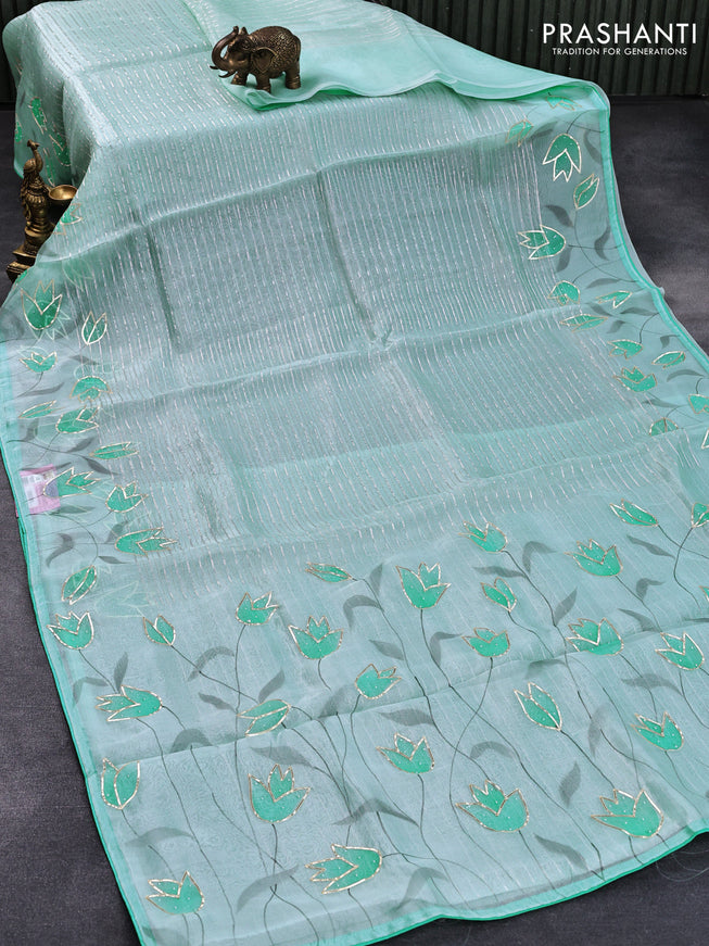 Pure organza silk saree light blue with allover silver zari stripes pattern and floral design beaded work border