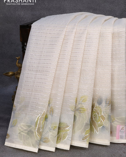 Pure organza silk saree off white with allover silver zari stripes pattern and floral design beaded work border