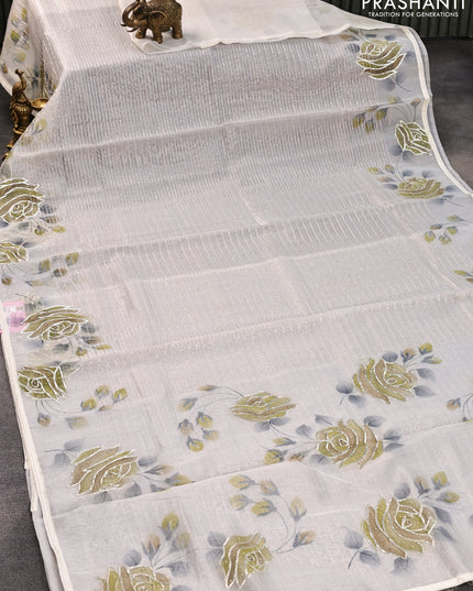 Pure organza silk saree off white with allover silver zari stripes pattern and floral design beaded work border
