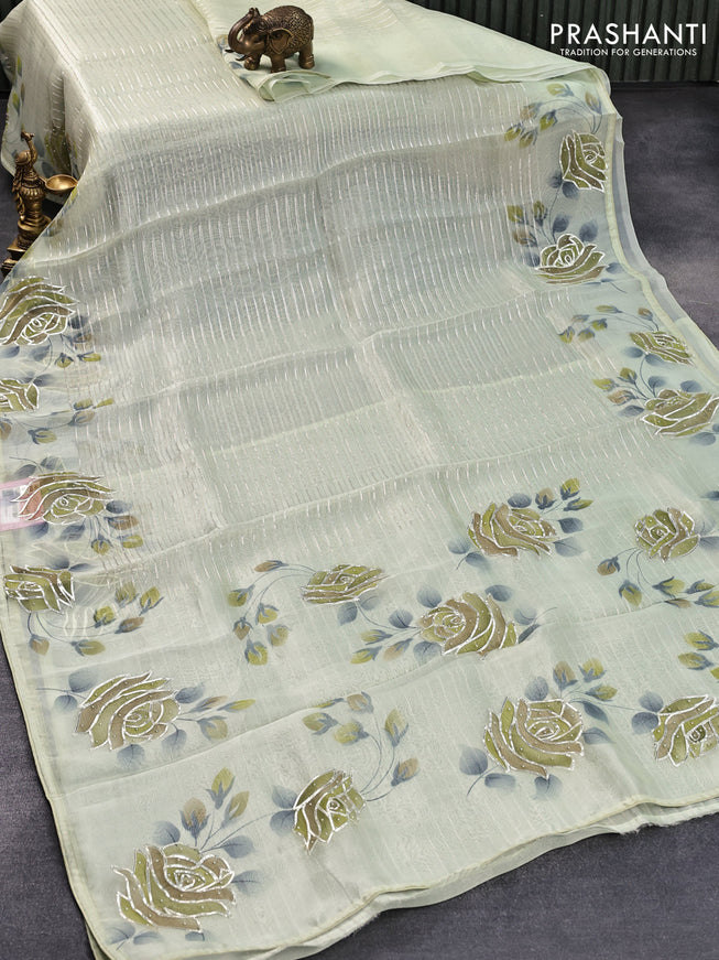 Pure organza silk saree pista green with allover silver zari stripes pattern and floral design beaded work border