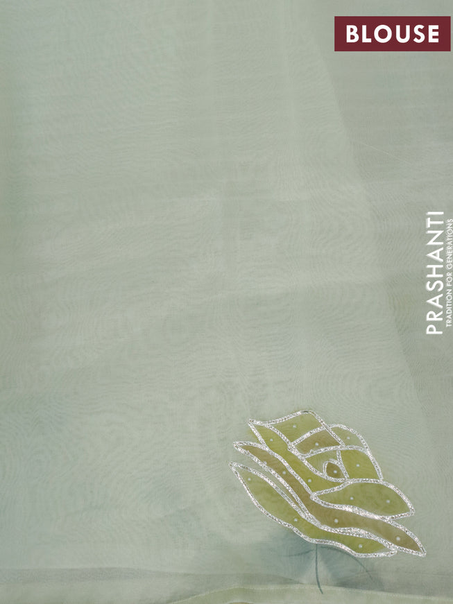 Pure organza silk saree pista green with allover silver zari stripes pattern and floral design beaded work border