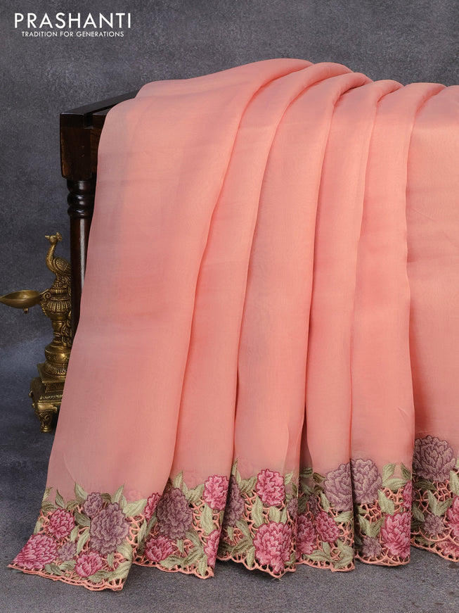 Pure organza silk saree peach orange with plain body and floral design embroidery cut work border