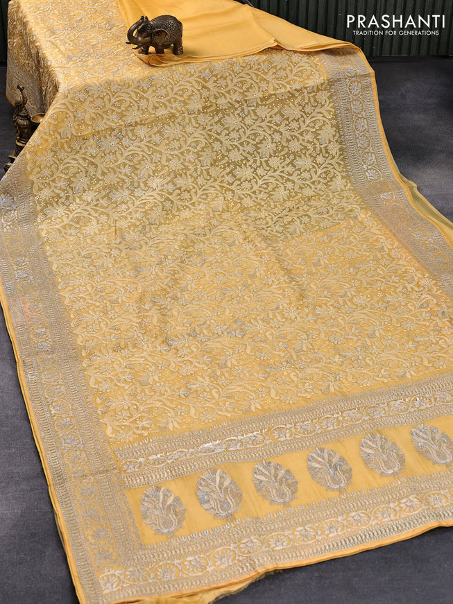 Pure organza silk saree yellow with allover embroidery work and embroidery work border