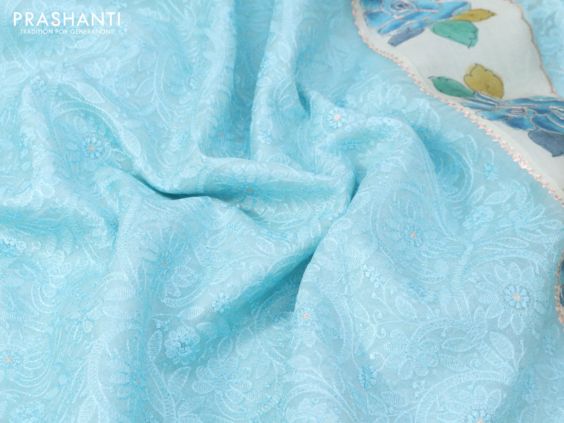 Pure organza silk saree light blue and cream with allover embroidery work and tussar kalamkari printed border