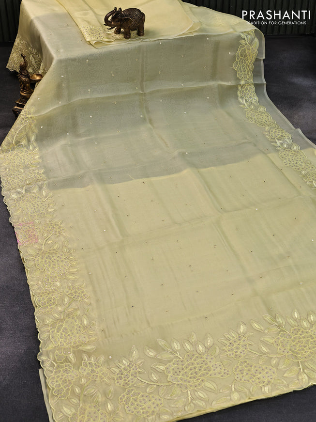 Pure organza silk saree pale yellow with mirror embroidery work and floral embroidery work border