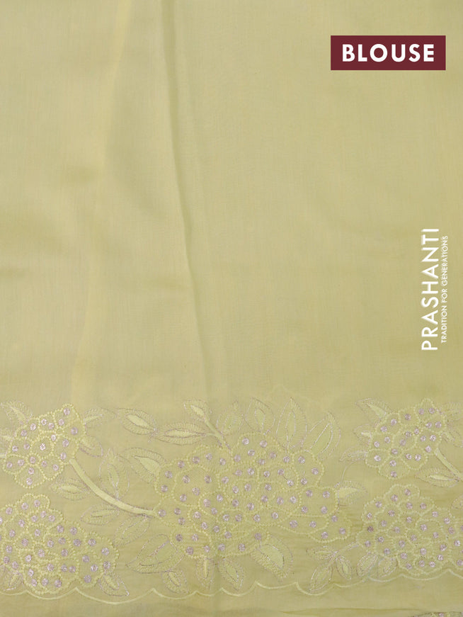 Pure organza silk saree pale yellow with mirror embroidery work and floral embroidery work border