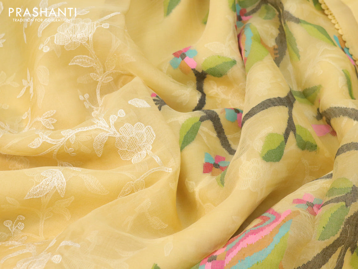 Pure organza silk saree yellow shade with allover floral embroidery work and lace work border