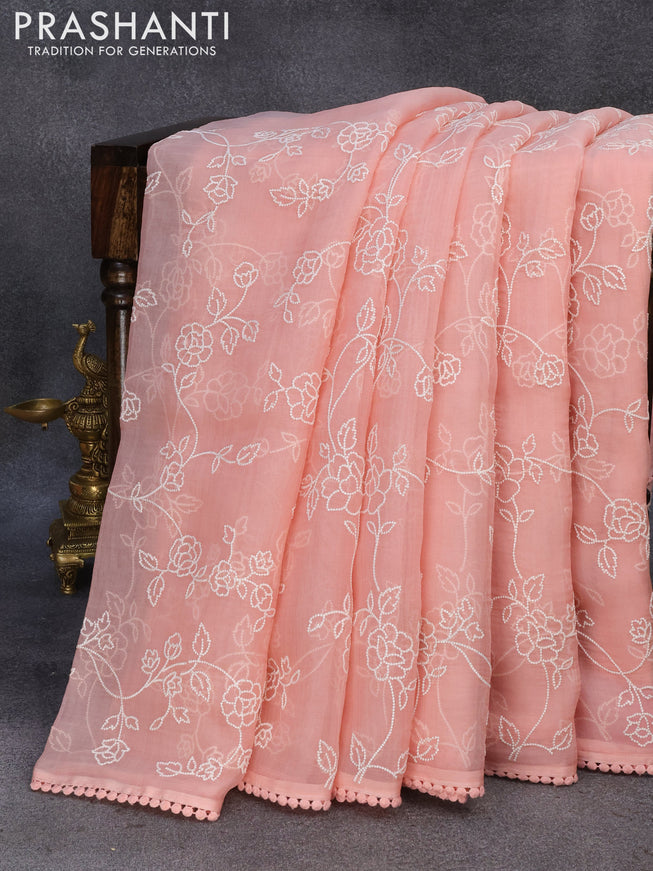 Pure organza silk saree peach shade with allover embroidery work and lace work border
