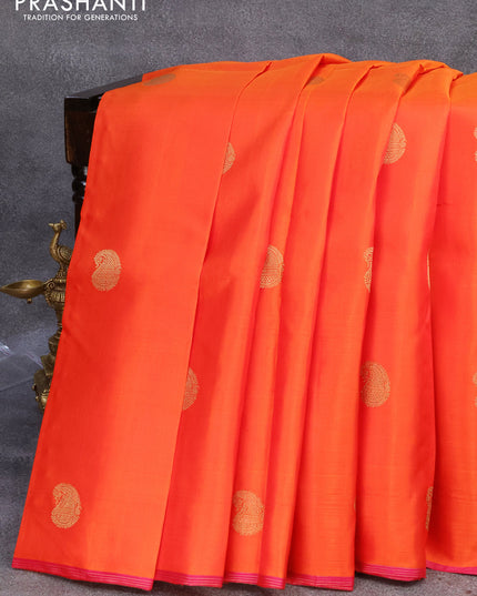 Pure kanjivaram silk saree orange and pink with zari woven paisley buttas and piping border