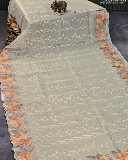 Tissue sarees pastel shade with allover embroidery work and floral embroidery work border