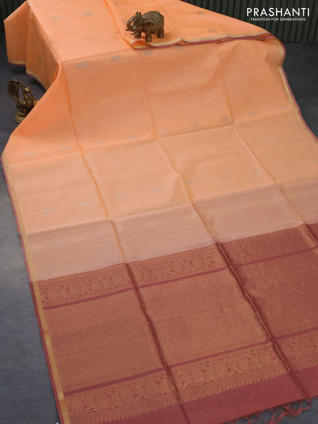 Kora silk cotton saree peach orange and pastel maroon with silver & gold zari woven leaf buttas and zari woven piping border