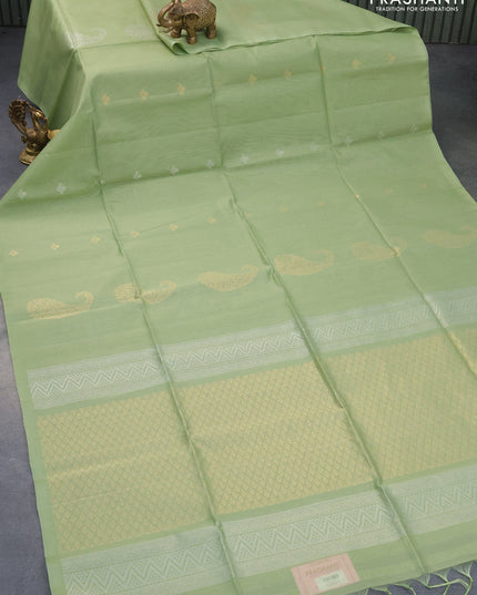 Kora silk cotton saree pastel green with zari woven paisley buttas in borderless style