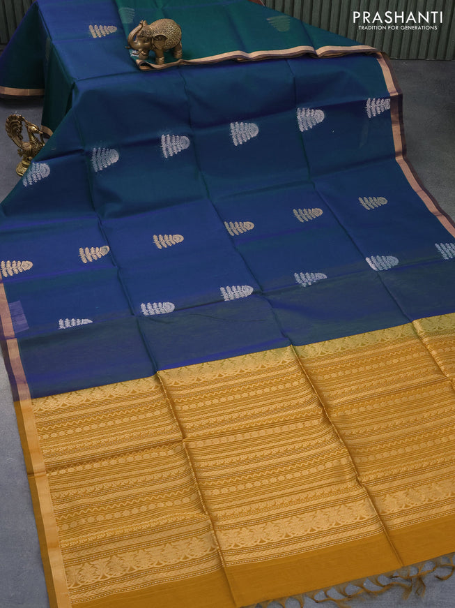 Kora silk cotton saree dual shade of bluish green and mustard green with silver & gold zari woven buttas and zari woven border