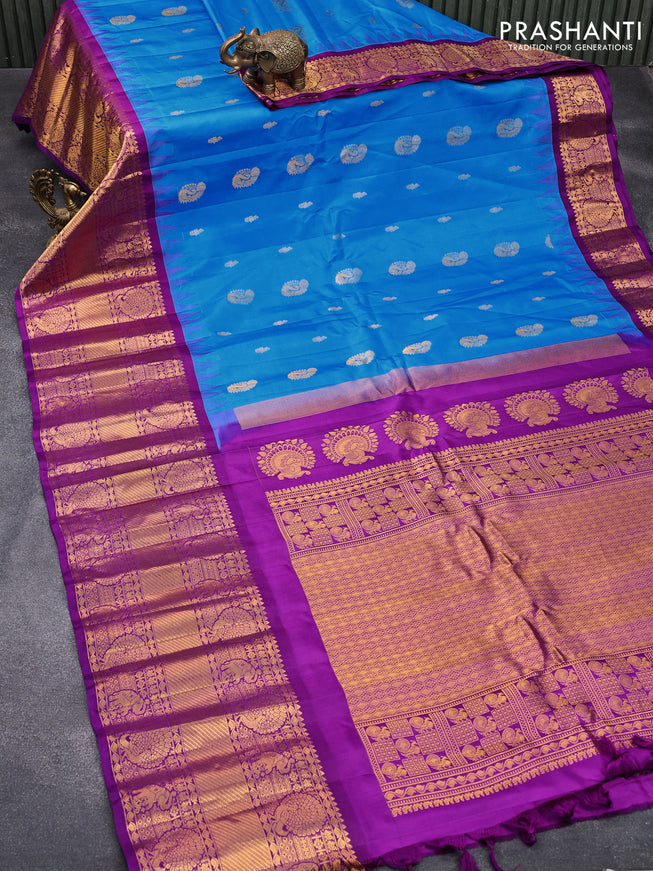 Pure gadwal silk saree cs blue and purple with allover zari woven buttas and temple design long elephant & peacock zari woven border