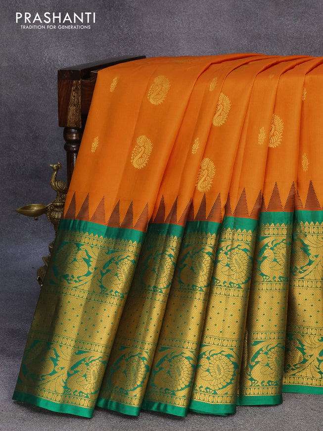Pure gadwal silk saree orange and green with allover zari woven buttas and temple design long annam zari woven border