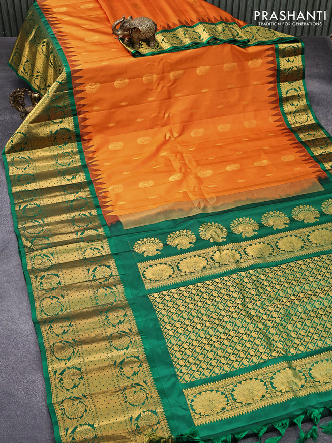 Pure gadwal silk saree orange and green with allover zari woven buttas and temple design long annam zari woven border