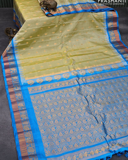 Pure gadwal silk saree elaichi green and cs blue with allover zari woven buttas and temple design zari woven border