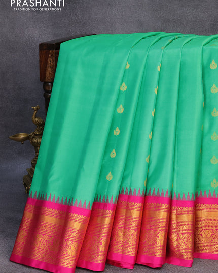 Pure gadwal silk saree teal green and pink with zari woven buttas and temple design zari woven border