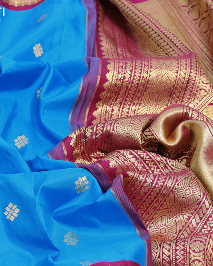Pure gadwal silk saree cs blue and dark magenta pink with zari woven buttas and long zari woven border