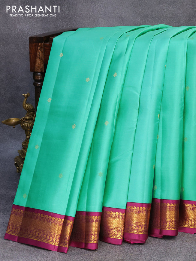 Pure kanjivaram silk saree teal green and purple with zari woven buttas and zari woven korvai border