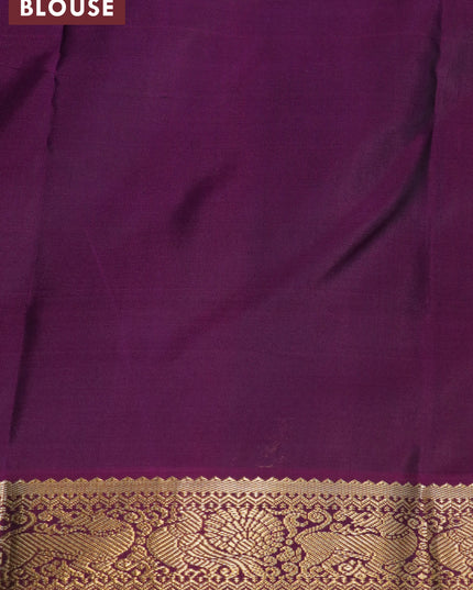 Pure kanjivaram silk saree dual shade of teal blue and purple with allover self emboss & zari buttas and annam zari woven korvai border