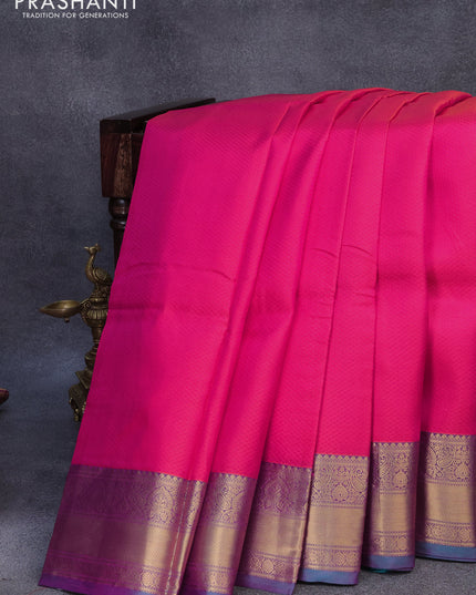 Pure kanjivaram silk saree dual shade of pinkish orange and teal green with allover self emboss and zari woven border
