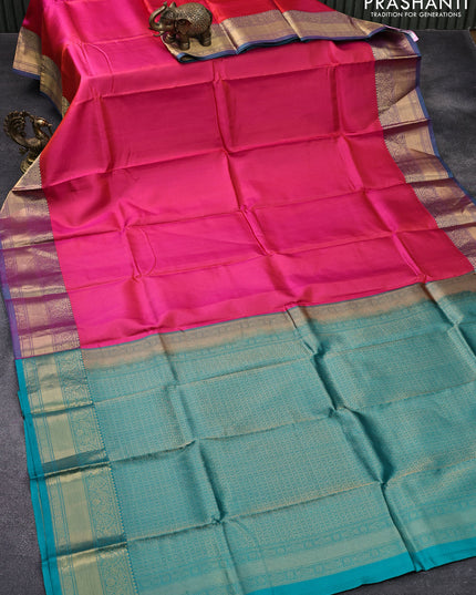 Pure kanjivaram silk saree dual shade of pinkish orange and teal green with allover self emboss and zari woven border