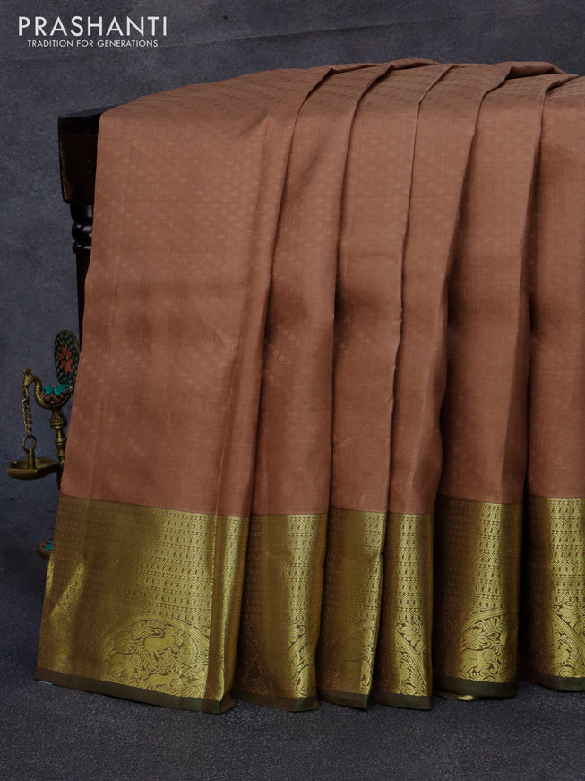 Pure kanjivaram silk saree pastel brown and green with allover self emboss and zari woven border
