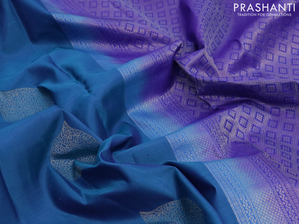 Pure kanjivaram silk saree dual shade of teal blue and blue with zari woven leaf buttas in borderless style