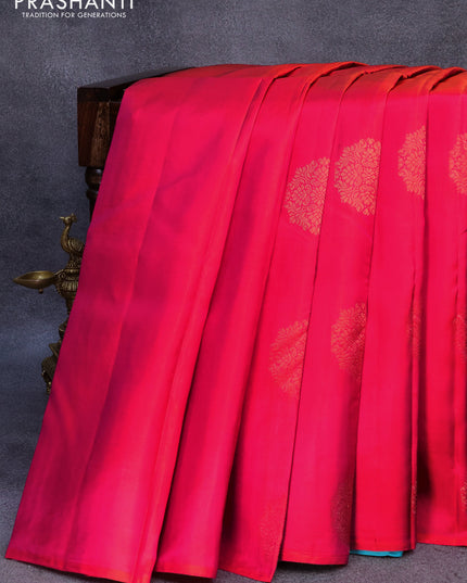 Pure kanjivaram silk saree dual shade of pinkish orange and light blue with zari woven buttas in borderless style