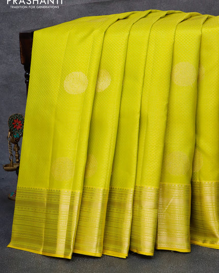 Pure kanjivaram silk saree lime yellow and purple with allover self emboss & zari buttas and zari woven border