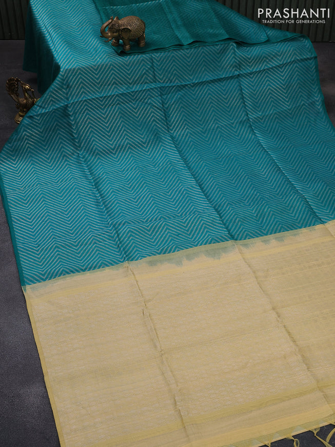 Pure raw silk saree teal green and cream with allover silver zari weaves in borderless style
