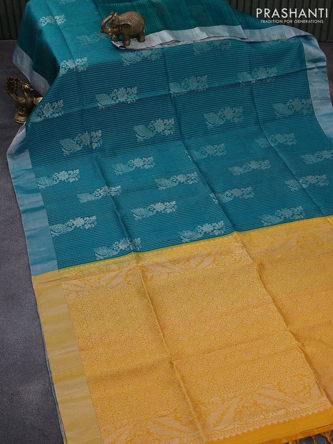 Pure raw silk saree dual shade of teal blue and yellow with silver zari woven butta weaves and silver zari woven border