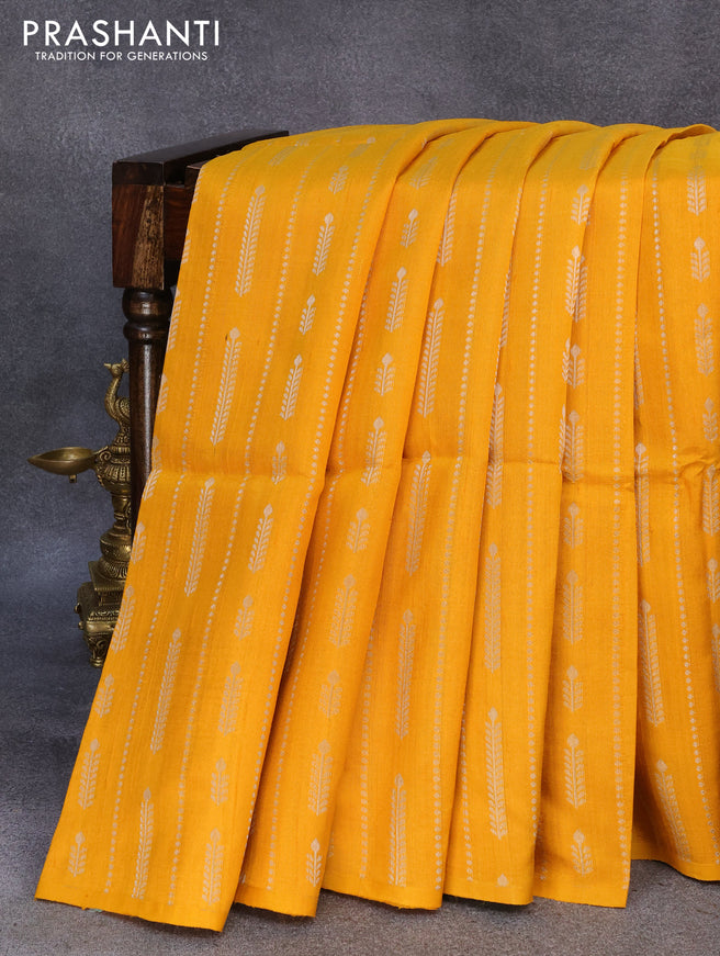 Pure raw silk saree yellow and green with allover silver zari weaves in borderless style