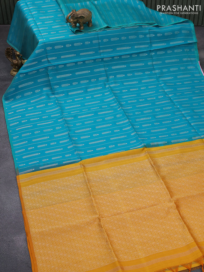 Pure raw silk saree teal blue and mustard yellow with allover silver zari weaves in borderless style