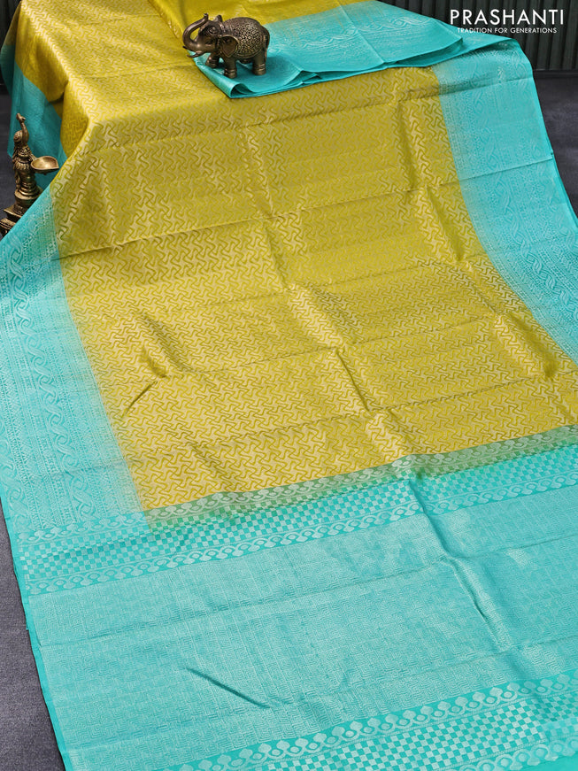 Pure soft silk saree yellow and teal blue with allover silver zari woven brocade weaves and silver zari woven border