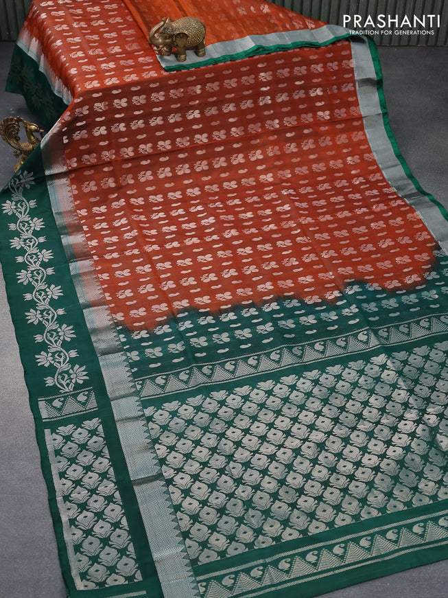 Pure uppada silk saree rustic orange and dark green with allover silver zari woven butta weaves and silver zari woven border
