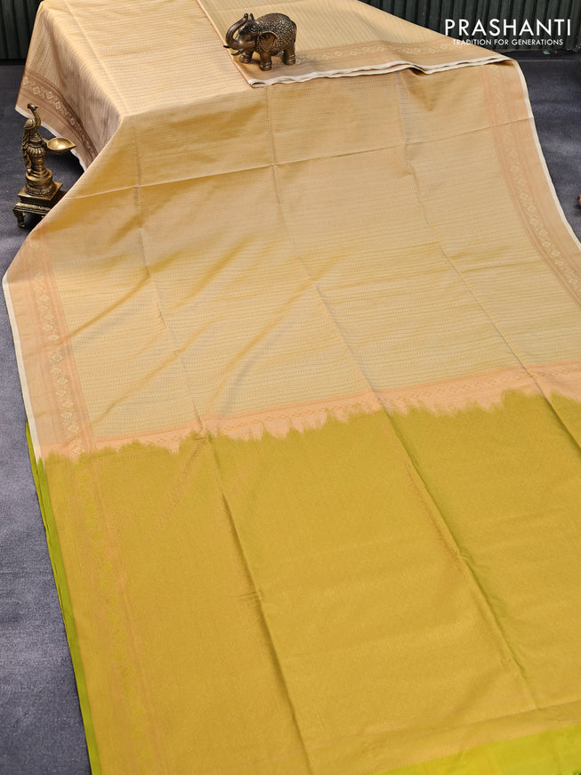 Semi soft silk saree pale yellow and lime green with allover copper zari weaves and copper zari woven border