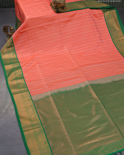 Semi soft silk saree peach orange and green with allover self emboss & copper zari weaves and zari woven border