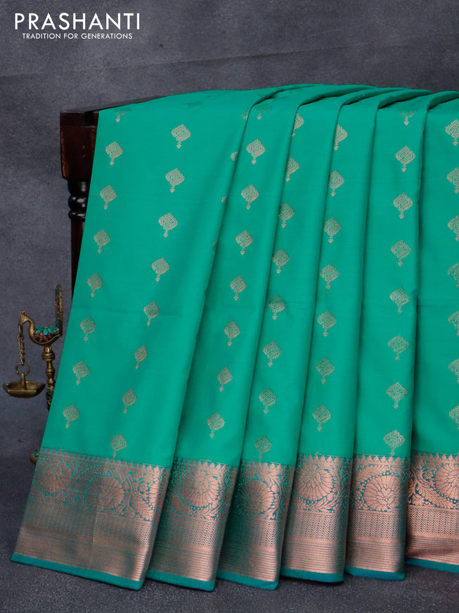 Semi soft silk saree teal green and blue with allover zari woven buttas and copper zari woven border