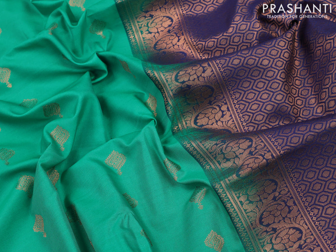 Semi soft silk saree teal green and blue with allover zari woven buttas and copper zari woven border