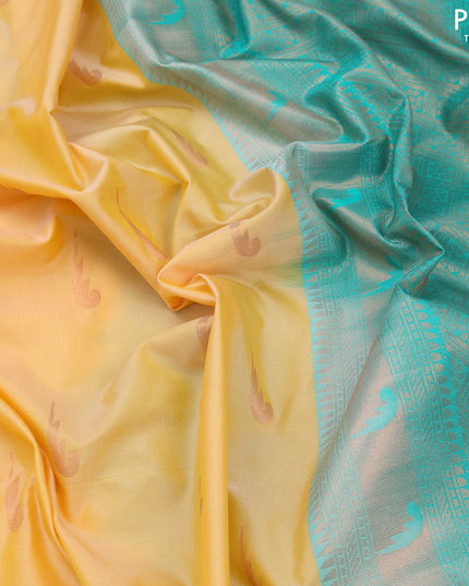 Semi soft silk saree yellow and teal blue with zari woven buttas and copper zari woven border