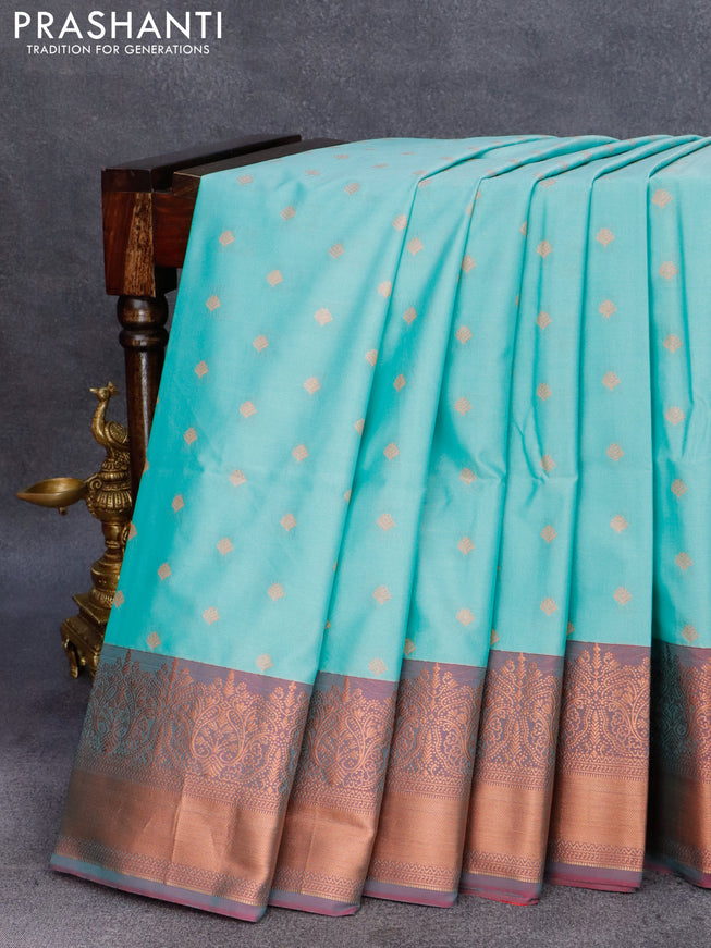 Semi soft silk saree teal blue and dual shade of pinkish orange with allover zari woven butta weaves and copper zari woven border