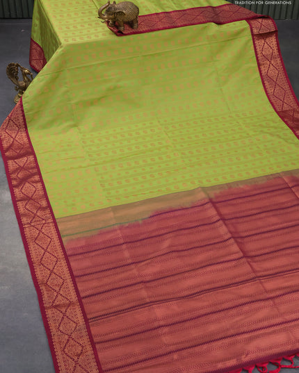 Semi soft silk saree light green and dark magenta with allover copper zari weaves and copper zari woven border