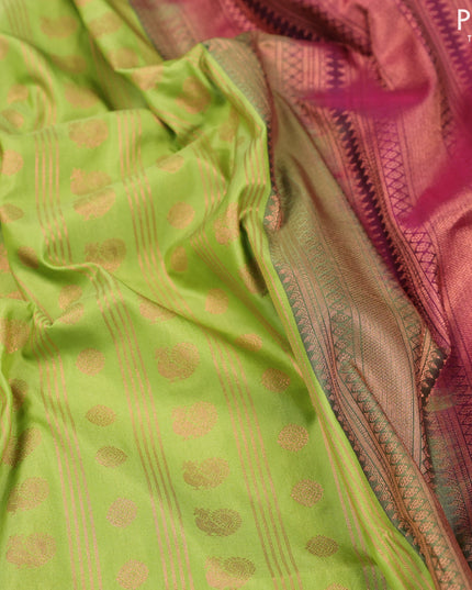 Semi soft silk saree light green and dark magenta with allover copper zari weaves and copper zari woven border