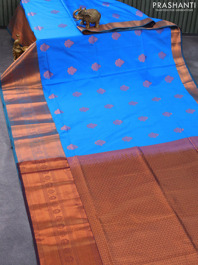 Semi soft silk saree cs blue and deep jamun shade with copper zari woven buttas and long copper zari woven border